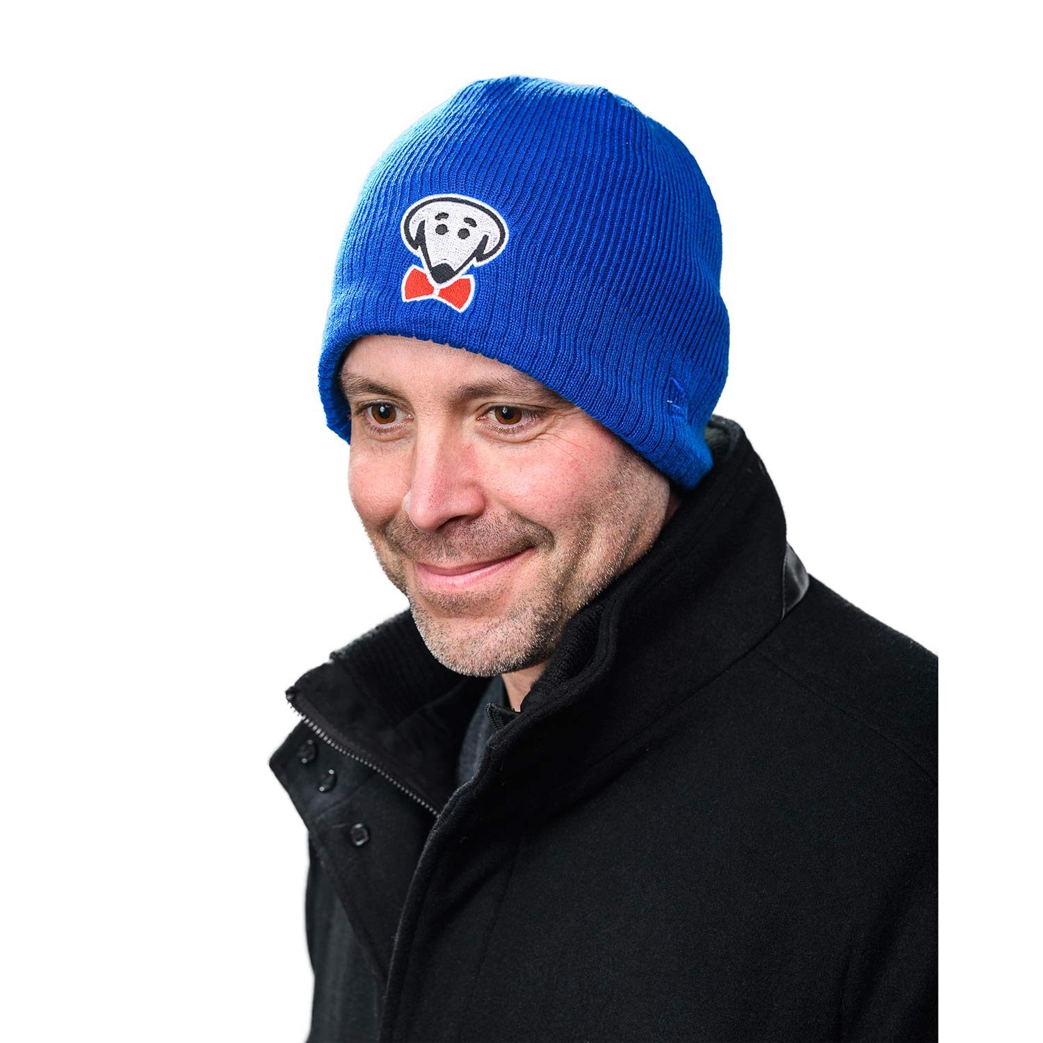 Kind of a polite smile. Like someone said something not that funny but he didn't want to be rude. - Taylor winter knit hat in royal blue by Beau Tyler