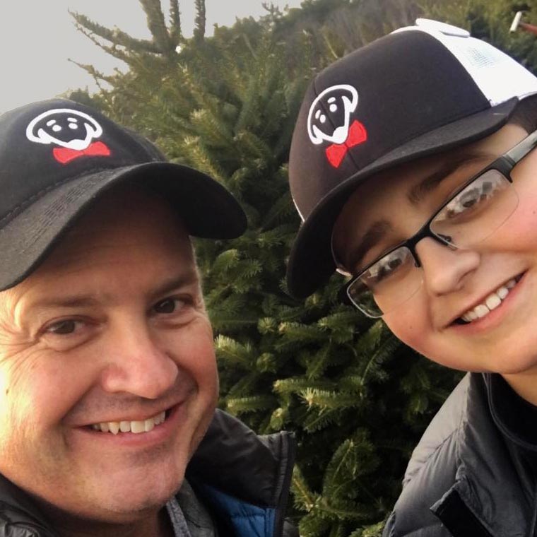 Ezra Baseball Hat in Black: Chris and his son